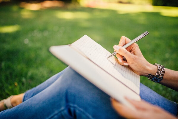 Lady Writting A Note Book