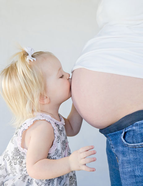 Girl Kissing Pregnant Women