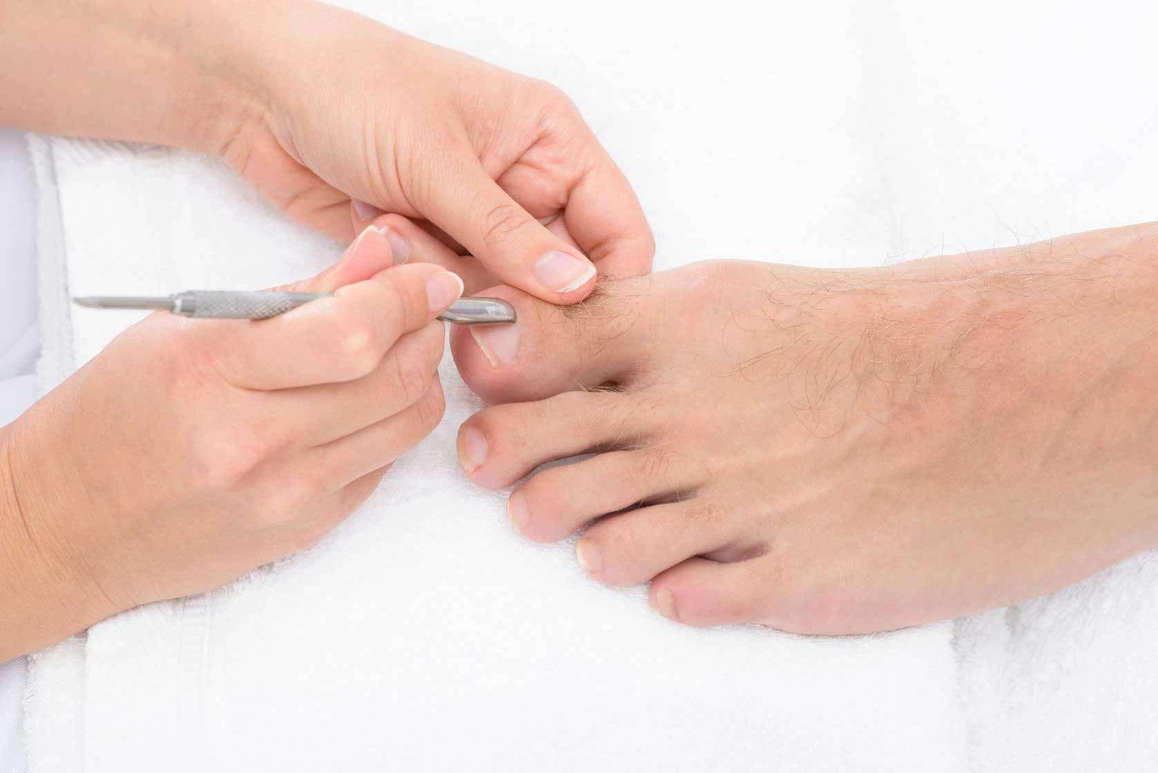 Mans foot foot receiving pedecure