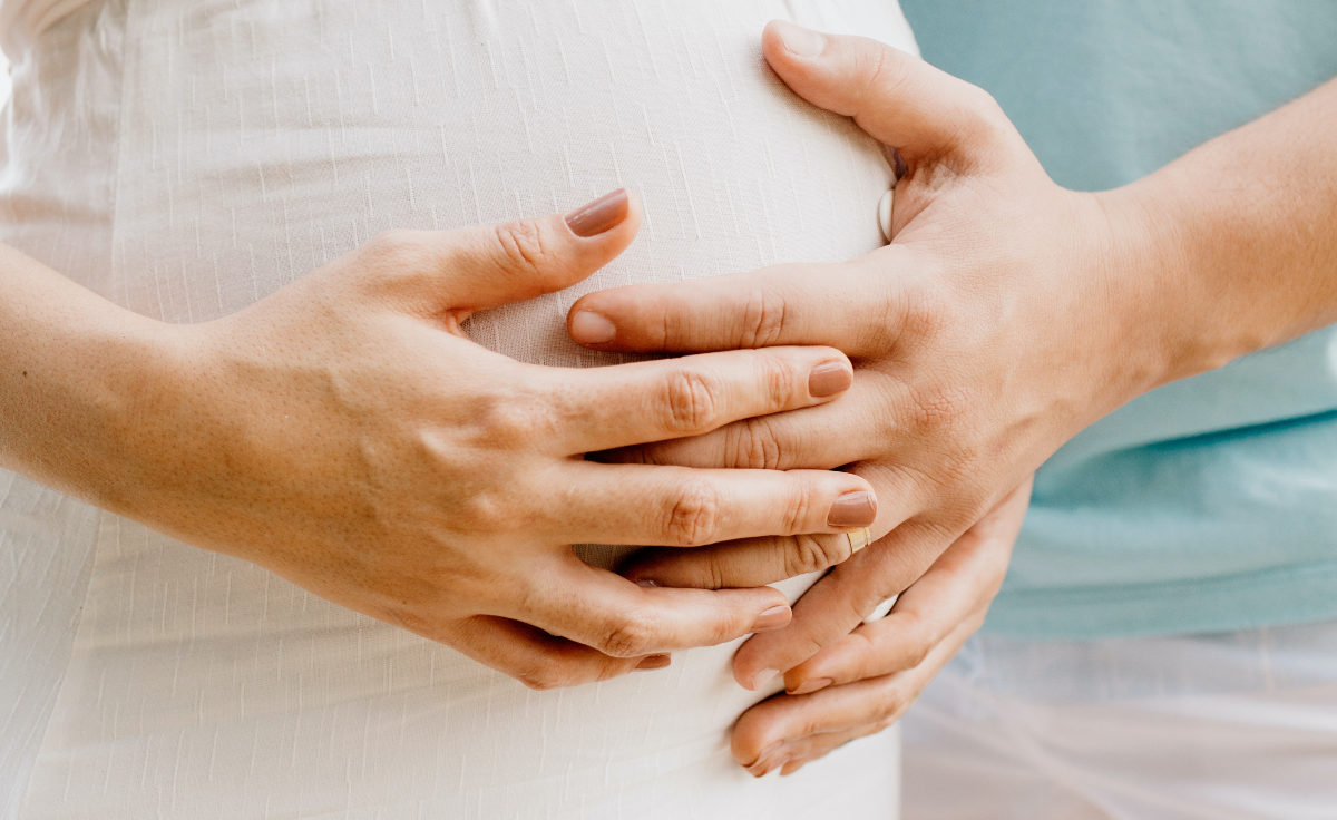 Hands Holding Pregnancy Bump